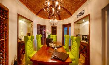 a room filled with furniture and a large mirror
