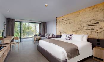 a bedroom with a large bed in a room