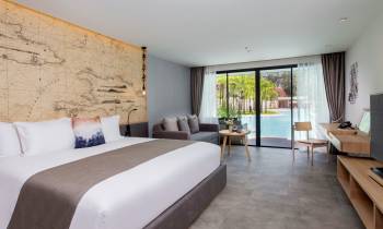 a bedroom with a large bed in a hotel room