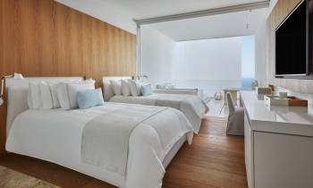 a bedroom with a large bed in a room