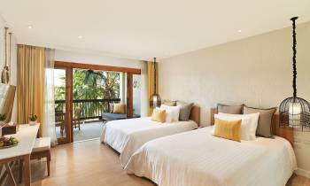 a bedroom with a large bed in a hotel room