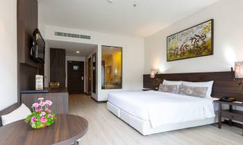a bedroom with a large bed in a room