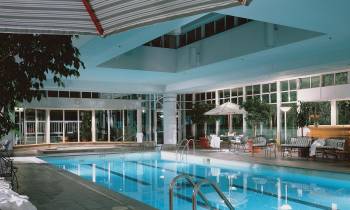 a chair sitting in front of a pool