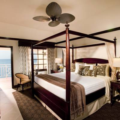 a bedroom with a large bed in a hotel room