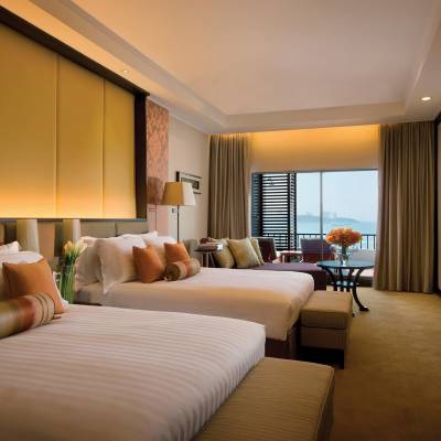 a bedroom with a large bed in a hotel room