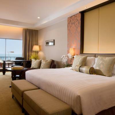 a bedroom with a large bed in a hotel room