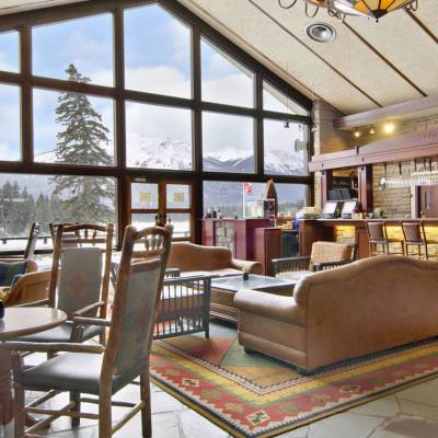 a living room filled with furniture and a large window