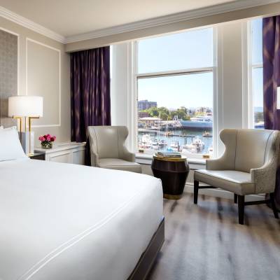 a bedroom with a large bed in a hotel room