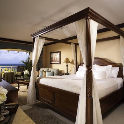 a bedroom with a large bed in a hotel room