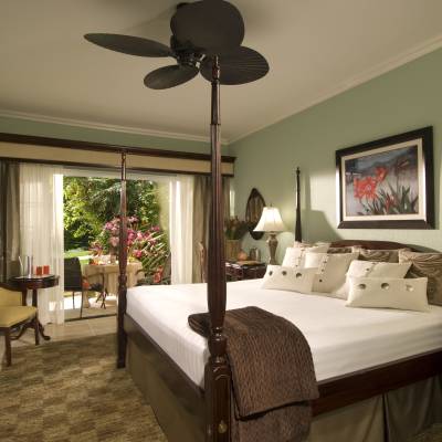 a bedroom with a large bed in a room