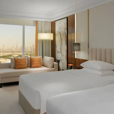 a bedroom with a large bed in a hotel room