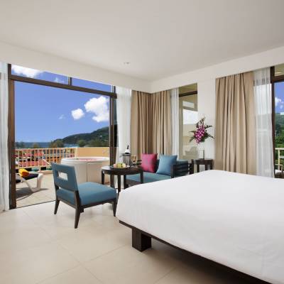 a bedroom with a large bed in a hotel room