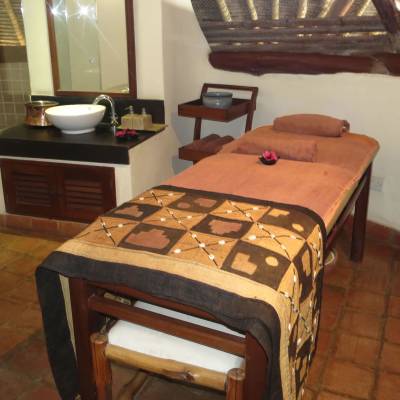 a bedroom with a bed and desk in a small room