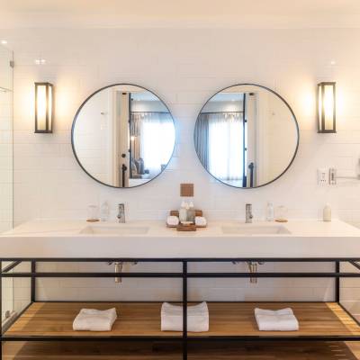 a room with a sink and a mirror