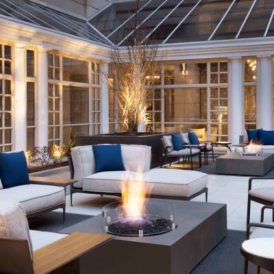 a living room filled with furniture and a large window