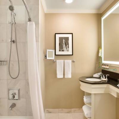 a room with a sink and a mirror