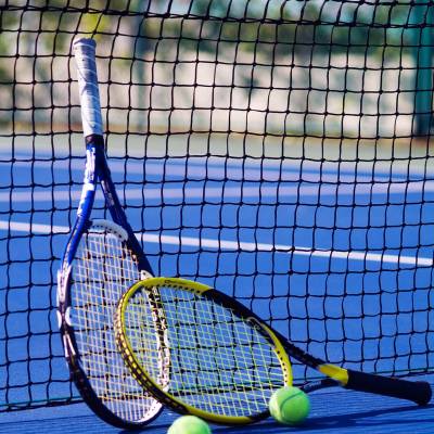a person hitting a ball with a racket