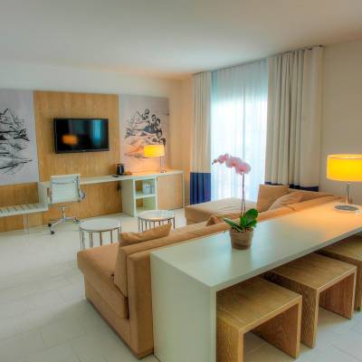 a room filled with furniture and a large window