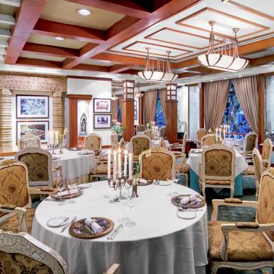 a room filled with furniture and vase on a table