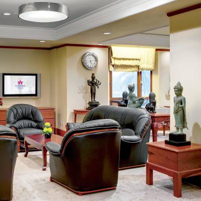 a living room filled with furniture and a fireplace
