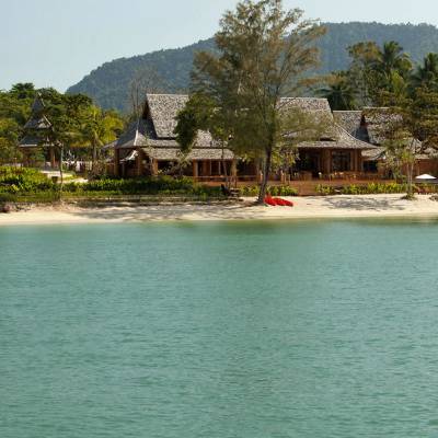 a house next to a body of water