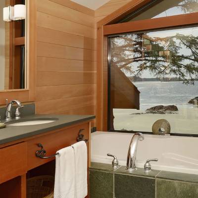 a white sink sitting under a window