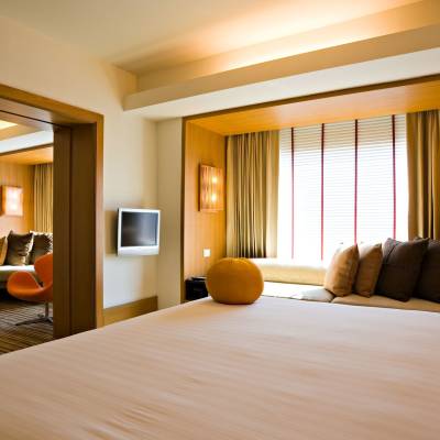 a bedroom with a large bed in a hotel room