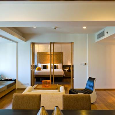 a view of a living room filled with furniture and a mirror