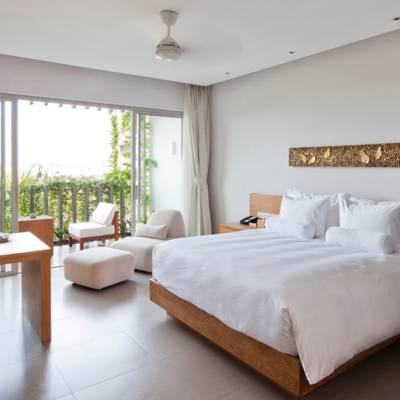 a bedroom with a large bed in a room