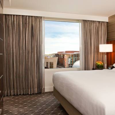 a bedroom with a bed in a hotel room
