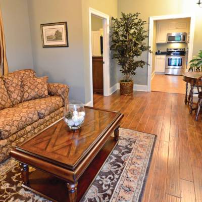 a living room filled with furniture and a fireplace