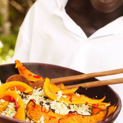 a person holding a plate of food