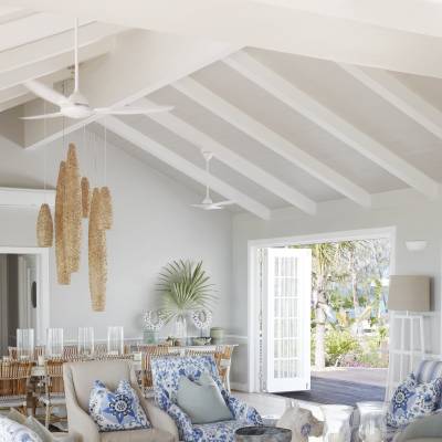 a living room filled with furniture and a large window
