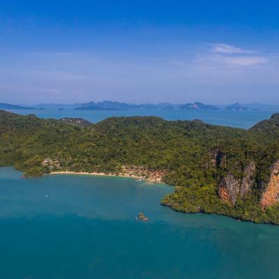 a body of water with a mountain in the background