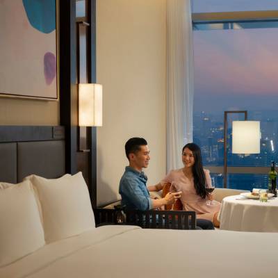 a person sitting on a bed