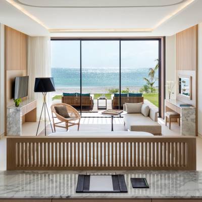 a view of a living room filled with furniture and a large window