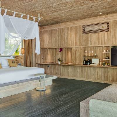 a bedroom with a bed in a room