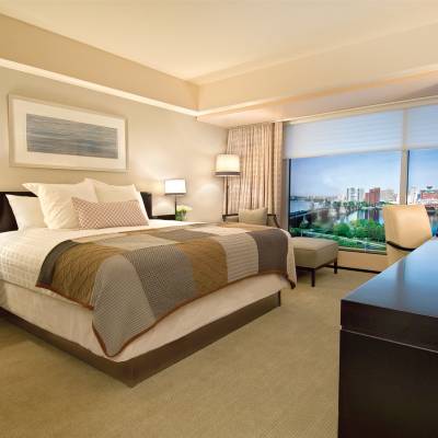 a bedroom with a large bed in a hotel room