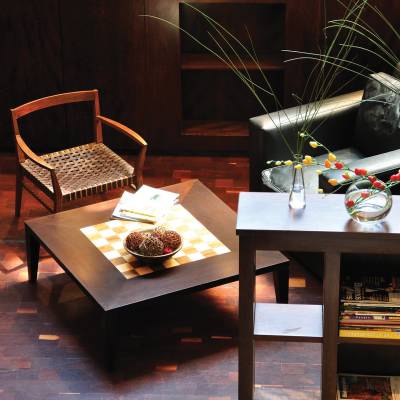 a room filled with furniture and vase on a table