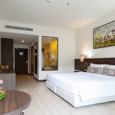 a bedroom with a large bed in a room