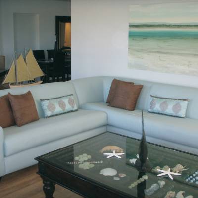 a living room filled with furniture and a large window