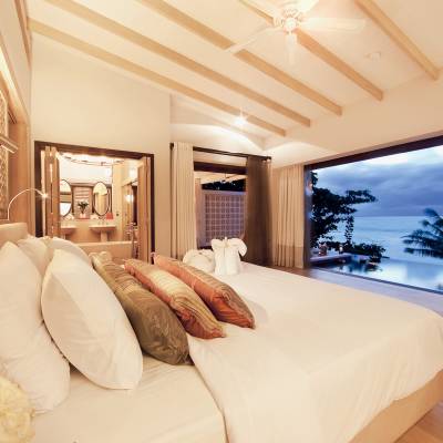 a bedroom with a large bed in a hotel room