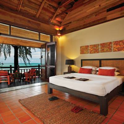 a bedroom with a tiled floor in a room