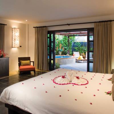 a bedroom with a large bed in a hotel room