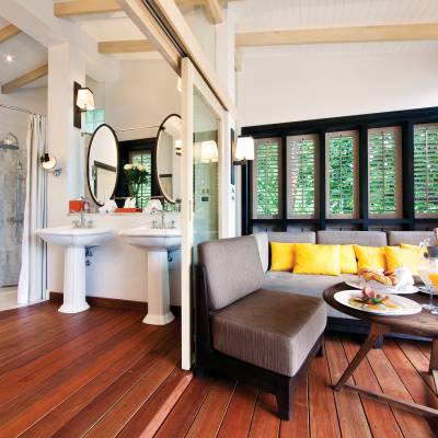 a living room with a fireplace and a large window