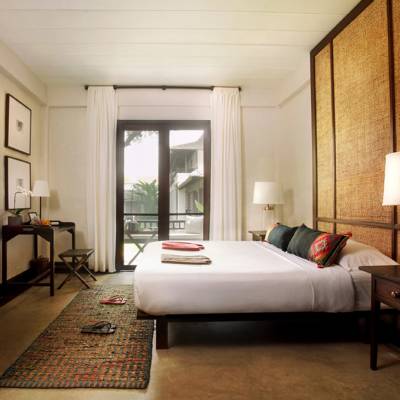 a bedroom with a view of a living room
