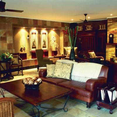 a living room filled with furniture and a fireplace
