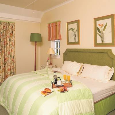 a bedroom with a bed in a room