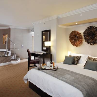 a bedroom with a large bed in a hotel room