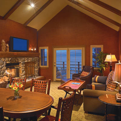 a living room filled with furniture and a fireplace
